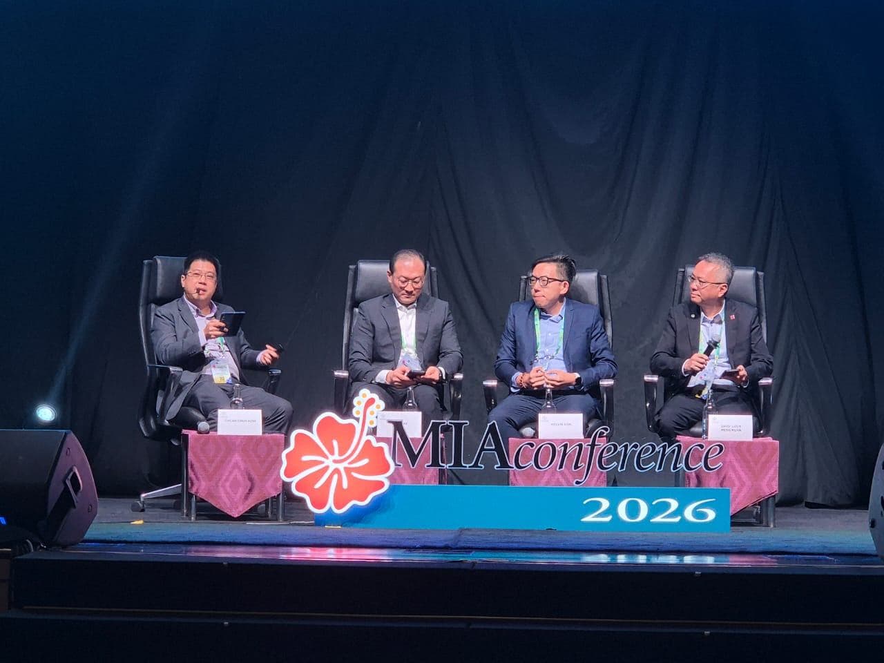 Four panellists seated on stage in front of the MIA conference 2026 banner during the AI in Finance session